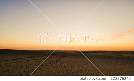 Beautiful sunset over sand dunes in the White Desert in Egypt Beautiful sunset over sand dunes in the White Desert in Egypt 128276243