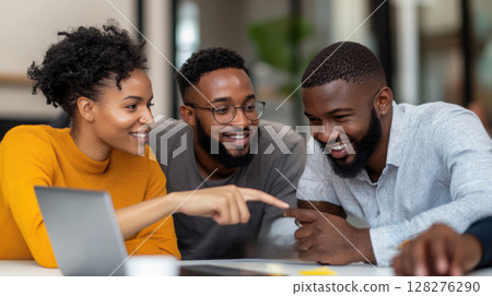 Collaborative team of diverse professionals analyzing conversion rates on laptop in modern startup meeting room. Data scientist 128276290