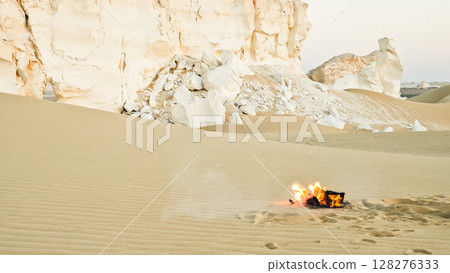 Campfire in the night camp in the White Desert in Egypt. Fire under the sky 128276333