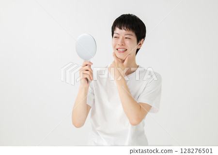 Man smiling in the mirror Man smiling in the mirror 128276501