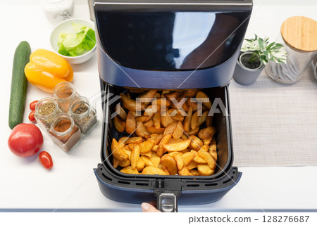 Air fryer machine in the kitchen 128276687