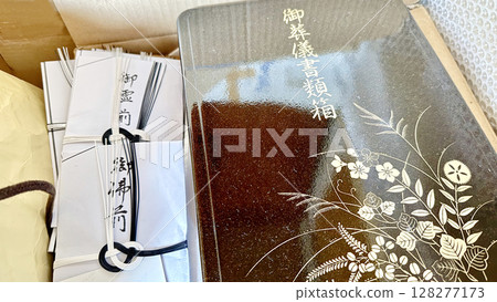A funeral document box and many condolence envelopes A funeral document box and many condolence envelopes 128277173