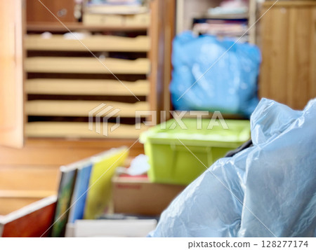 A messy room in the process of decluttering 128277174