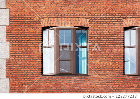 Window on a brick wall. 128277238