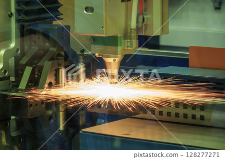 Close up scene the fiber laser cutting machine cut the metal plate control by CNC program. 128277271
