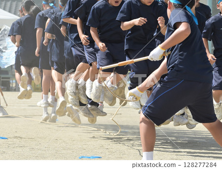 Young boys jumping rope Young boys jumping rope 128277284