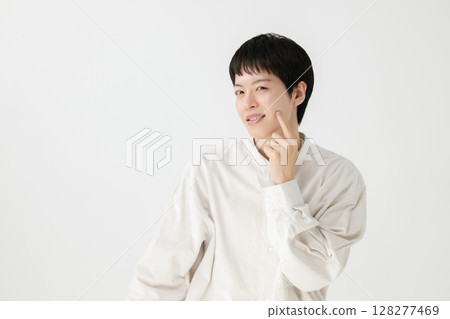 A man troubled watching the mirror A man troubled watching the mirror 128277469