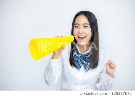 High school girl cheering with megaphone 128277673