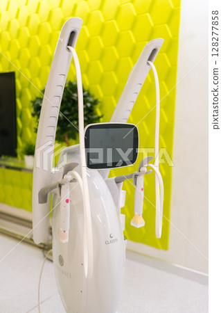Ufa, Russia - 10 April 2025. Vertical shot of professional cosmetology machine for mesotherapy treatment placing in modern beauty clinic. Concept of non-surgery cosmetology, professional skincare. Ufa, Russia - 10 April 2025. Vertical shot of professional cosmetology machine for mesotherapy treatment placing in modern beauty clinic. Concept of non-surgery cosmetology, professional skincare. 128277858