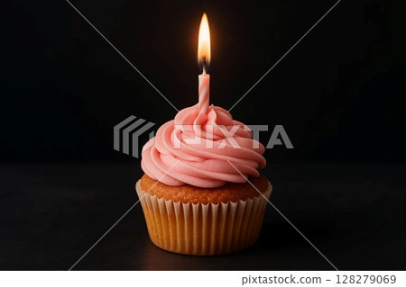 Single Cupcake with Pink Frosting and Candle on Dark Background 128279069