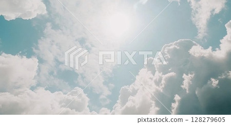 Clouds Float Gently Across a Serene Blue Sky with Dreamy Atmosphere 128279605