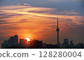 Toronto's skyline lit by sun raising behind the buildings 128280004
