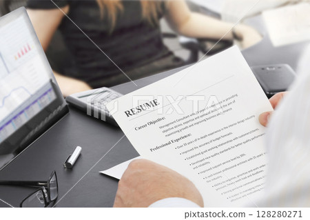 Job Interview in the Office with Focus on Resume Job Interview in the Office with Focus on Resume 128280271