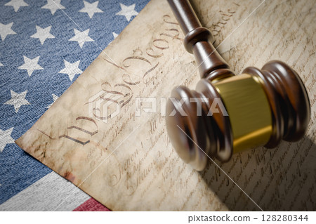 United States Constitution, Gavel and American Flag Resting on Table. United States Constitution, Gavel and American Flag Resting on Table. 128280344