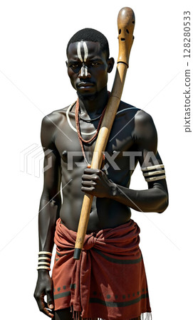 Dinka man stands confidently in South Sudan, his skin covered in ash to ward off insects. He is dressed in traditional attire, holding a wooden staff with an imposing presence. 128280533