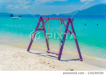 Turquoise sea and white sand.  128280598