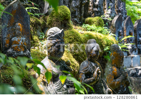 Buddhist statue group at Mitaki-Dera temple in Hiroshima, Japan 128280861