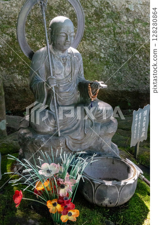 Monk statues and chozuya fountain at Daisho-in Temple, Miyajima Monk statues and chozuya fountain at Daisho-in Temple, Miyajima 128280864