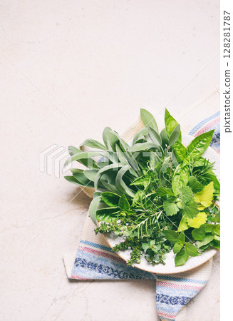 Fresh spicy and medicinal herbs on white background. Bouquet from various herb - rosemary, oregano, sage, marjoram, basil, thyme, mint. 128281787