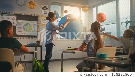 Primary School Children Studying Renewable Energy and Solar System in Modern Multiethnic Classroom 128281869