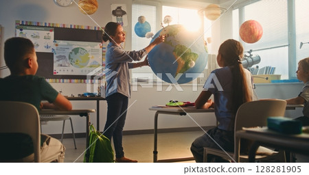 STEM Class on Renewable Energy: Female Teacher Explaining Energy Resources to Elementary School Students 128281905