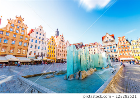 Fantastic view of the ancient homes on a sunny day. Location famous Market Square in Wroclaw, Poland, Europe. Historical capital of Silesia. Beauty world. 128282521
