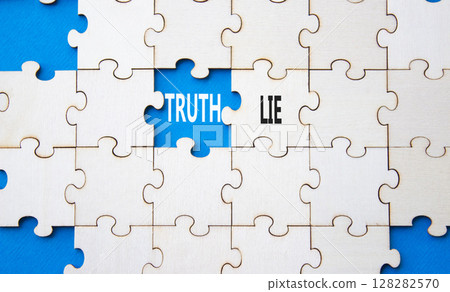 Truth or Lie symbol. Concept word Truth or Lie on wooden puzzle. Beautiful blue background. Business and Truth or Lie concept. Copy space 128282570