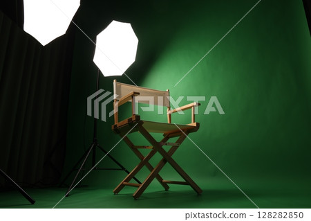 Chair of Film Director. Directors chair in green screen studio setup with softbox lighting. Ideal for filmmaking video production photo interviews and creative content with green chroma key background Chair of Film Director. Directors chair in green screen studio setup with softbox lighting. Ideal for filmmaking video production photo interviews and creative content with green chroma key background 128282850