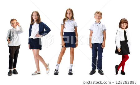 Group of schoolchildren in uniform standing isolated on white background 128282883