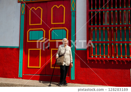 Senior woman at the beautiful colonial town of Concepcion located in the department of Antioquia in Colombia. 128283189