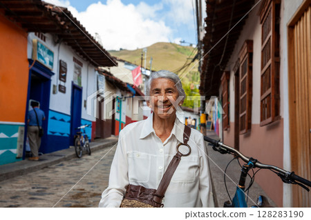 Senior woman at the beautiful colonial town of Concepcion located in the department of Antioquia in Colombia. Senior woman at the beautiful colonial town of Concepcion located in the department of Antioquia in Colombia. 128283190