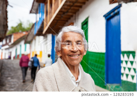 Senior woman at the beautiful colonial town of Concepcion located in the department of Antioquia in Colombia. 128283193