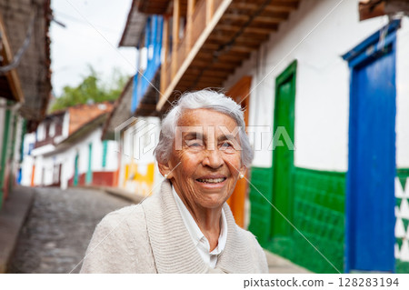 Senior woman at the beautiful colonial town of Concepcion located in the department of Antioquia in Colombia. 128283194