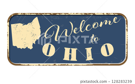 Welcome to Ohio. A worn blue plaque with the name and outline of the state. Welcome inscription on the road sign 128283239