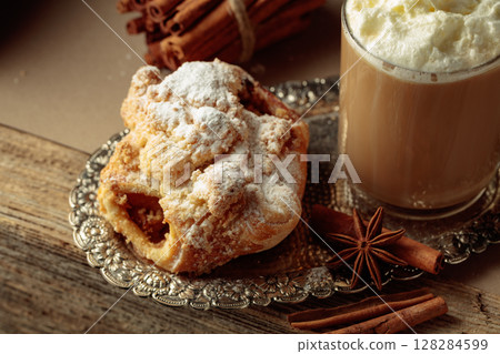 Vienna strudel and caffe latte on a silver tray. 128284599