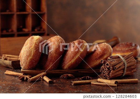 Swedish cinnamon rolls on a brown background. 128284603