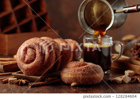 Swedish cinnamon rolls and black coffee. 128284604