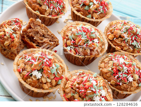 banana bread oat muffins with christmas sprinkles banana bread oat muffins with christmas sprinkles 128284616