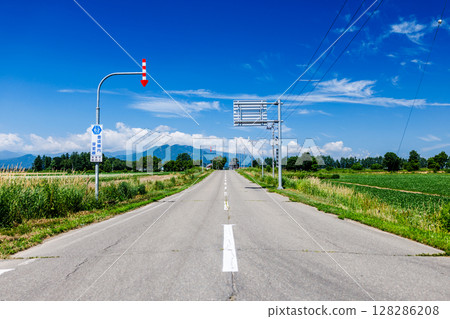 Blue sky and one road 128286208