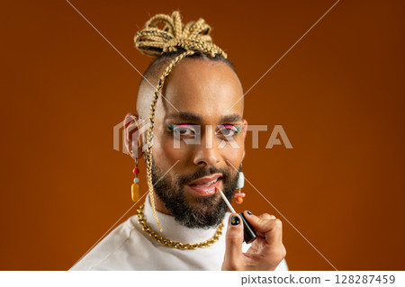 African american gay applying make up isolated on African american gay applying make up isolated on 128287459