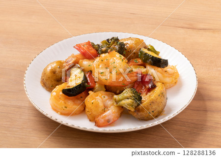 Ethnic grilled shrimp and roasted potatoes Ethnic grilled shrimp and roasted potatoes 128288136