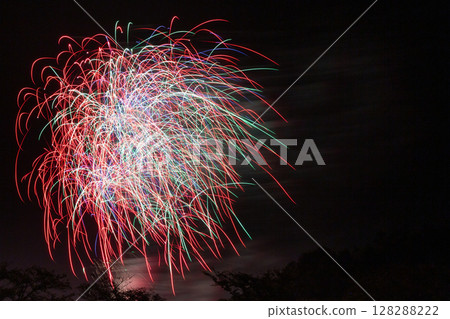 Colorful fireworks with beautiful light trails Colorful fireworks with beautiful light trails 128288222