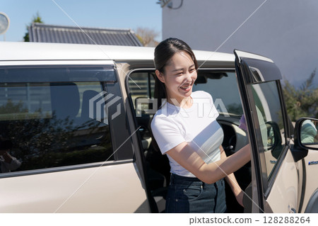 Woman cleaning the car Woman cleaning the car 128288264