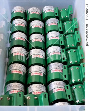 Small discarded chemical pumps lined up in a container Small discarded chemical pumps lined up in a container 128288521