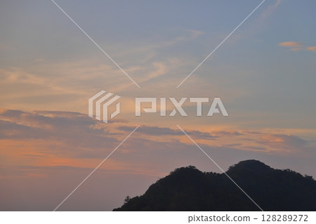 Sunset sky, clouds, mountains 128289272