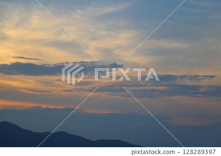 Sunset sky clouds mountains Sunset sky clouds mountains 128289397