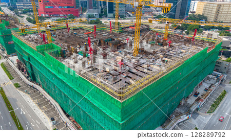 July 6 2025 Large Construction Site with Steel Scaffolding and Tower Cranes July 6 2025 Large Construction Site with Steel Scaffolding and Tower Cranes 128289792