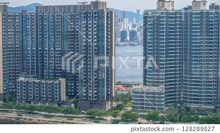 July 6 2025 Modern High-Rise Residential Towers with Urban Waterfront Views 128289827