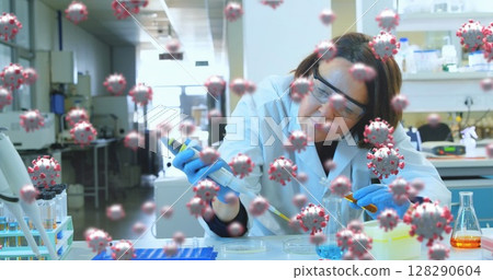 Scientist in laboratory conducting COVID-19 research with pipette and test tubes Scientist in laboratory conducting COVID-19 research with pipette and test tubes 128290604
