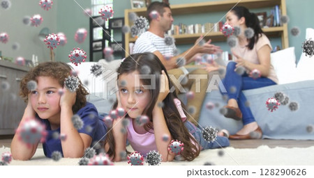 Image of macro Covid-19 cells floating over Caucasian family having a fight Image of macro Covid-19 cells floating over Caucasian family having a fight 128290626